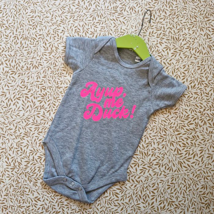 Ayup, me duck Bubble font baby grow grey with neon pink print