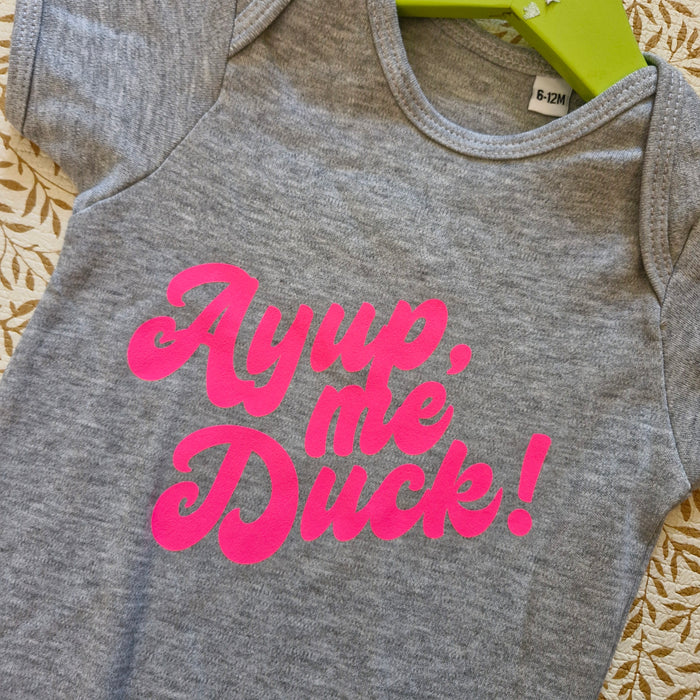 Ayup, me duck Bubble font baby grow grey with neon pink print