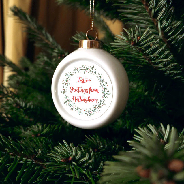 Festive Greetings from (place-name) Ceramic Christmas Bauble